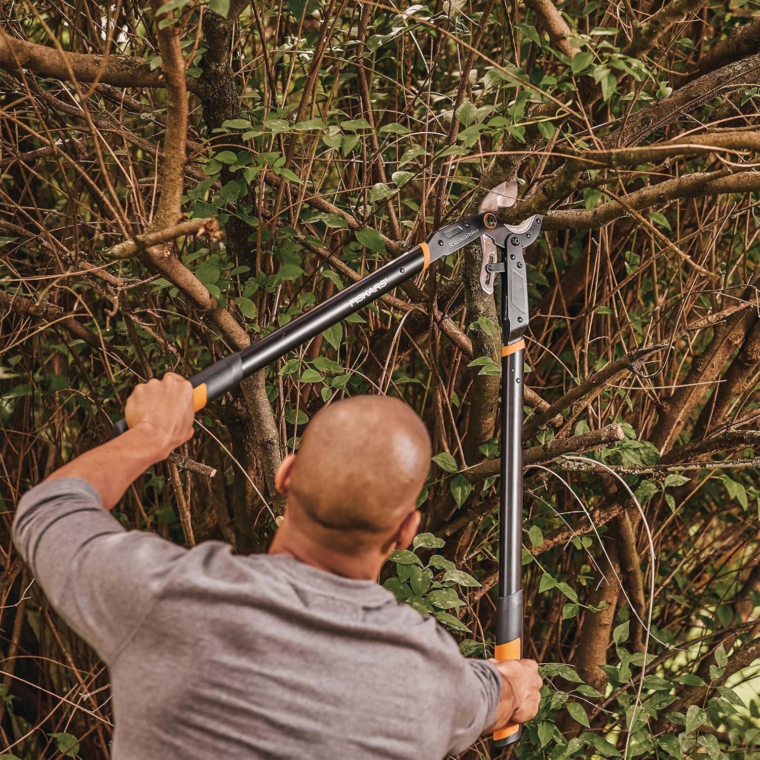 imageFiskars Ratchet Drive Anvil Lopper 32 Inch Heavy Duty Tree Trimmer 2 inch Cut Capacity Riveted Handles for Easy Squeeze Cutting PowerAnvil Lopper 32