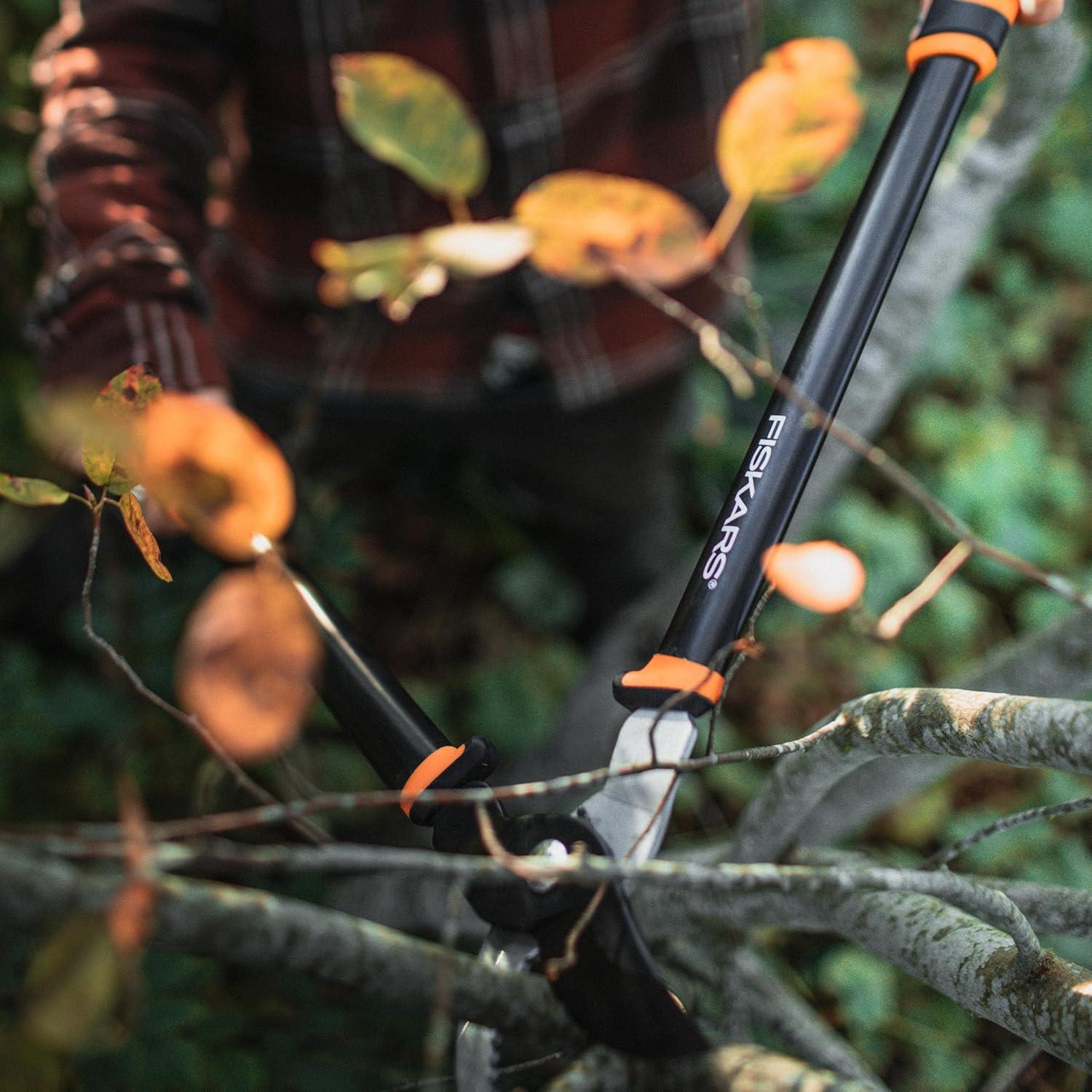 imageFiskars Ratchet Drive Anvil Lopper 32 Inch Heavy Duty Tree Trimmer 2 inch Cut Capacity Riveted Handles for Easy Squeeze Cutting PowerBypass Lopper 24
