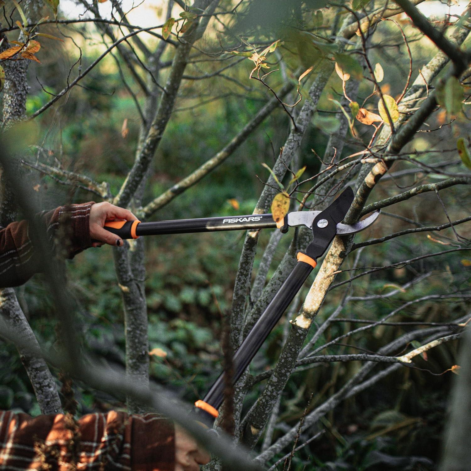 imageFiskars Ratchet Drive Anvil Lopper 32 Inch Heavy Duty Tree Trimmer 2 inch Cut Capacity Riveted Handles for Easy Squeeze Cutting PowerBypass Lopper 24
