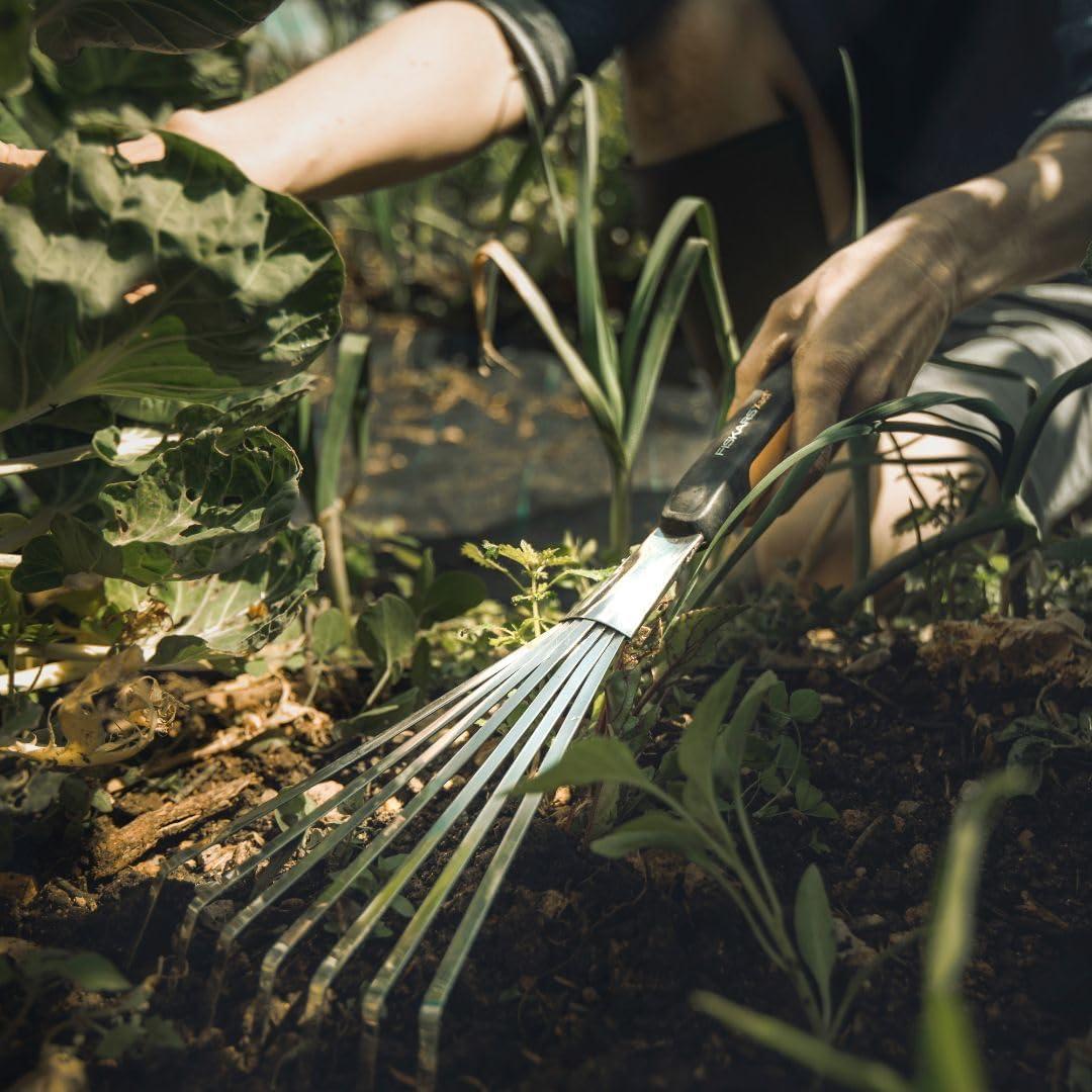 imageFiskars Xact Hand Rake Heavy Duty Gardening Hand Tool with Ergonomic Handle and Hanging Hole for Storage Stainless Steel Head and Tines Perfect for Maintaining a Raised Garden BedRake