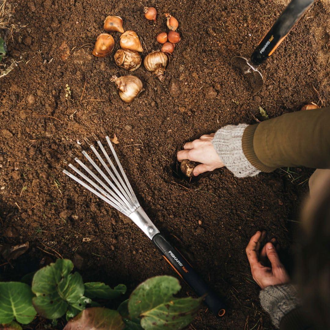 imageFiskars Xact Hand Rake Heavy Duty Gardening Hand Tool with Ergonomic Handle and Hanging Hole for Storage Stainless Steel Head and Tines Perfect for Maintaining a Raised Garden BedRake