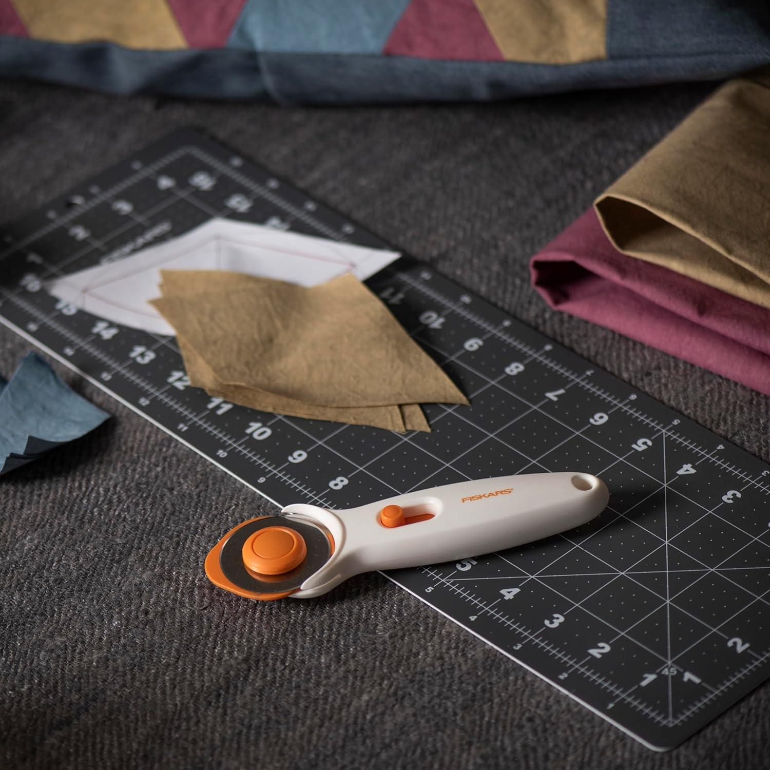 imageFiskars 45mm Rotary Cutter for Fabric Premium Steel Stick Fabric Cutter Cuts Through Multiple Layers Right and Left Handed Easy and Safe Blade Change Arts and Crafts Sewing and Quilting ToolsPremium Stick
