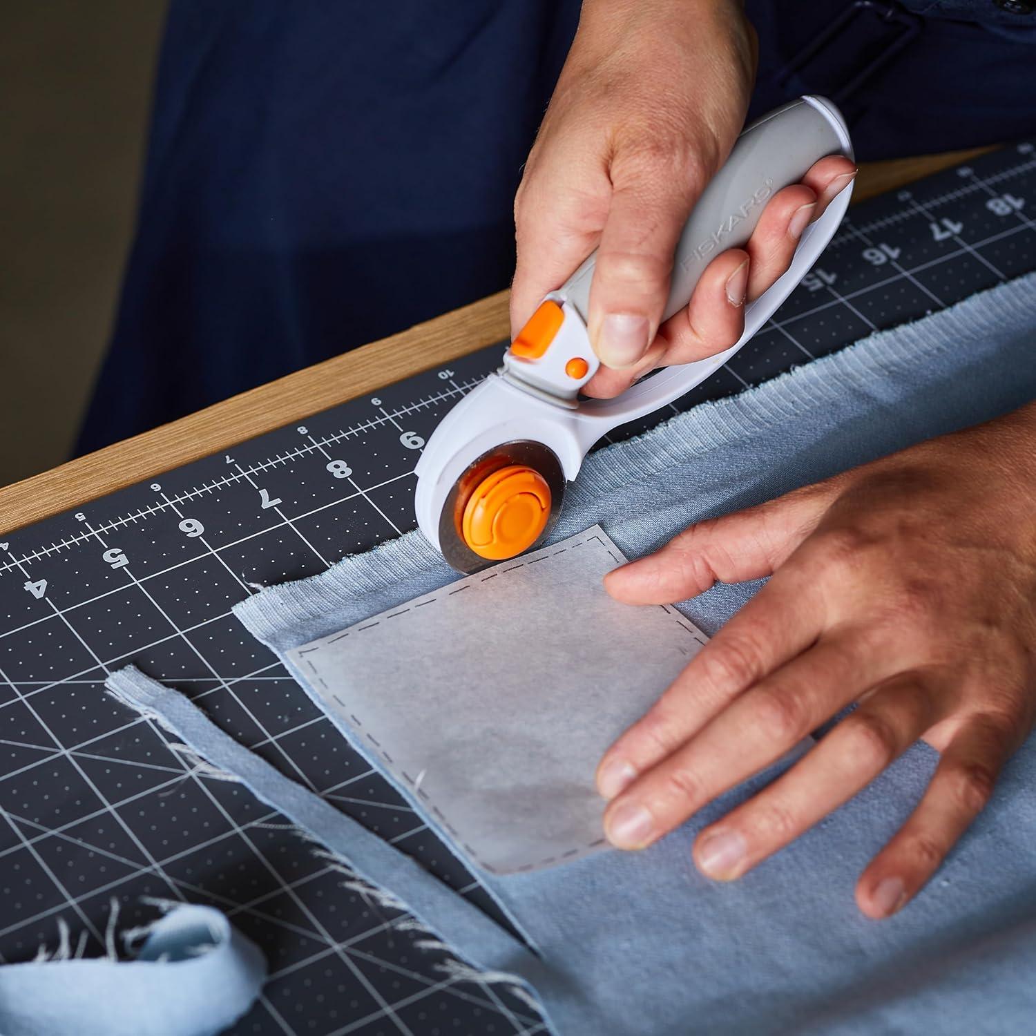 imageFiskars 45mm Rotary Cutter for Fabric Premium Steel Stick Fabric Cutter Cuts Through Multiple Layers Right and Left Handed Easy and Safe Blade Change Arts and Crafts Sewing and Quilting ToolsTitanium