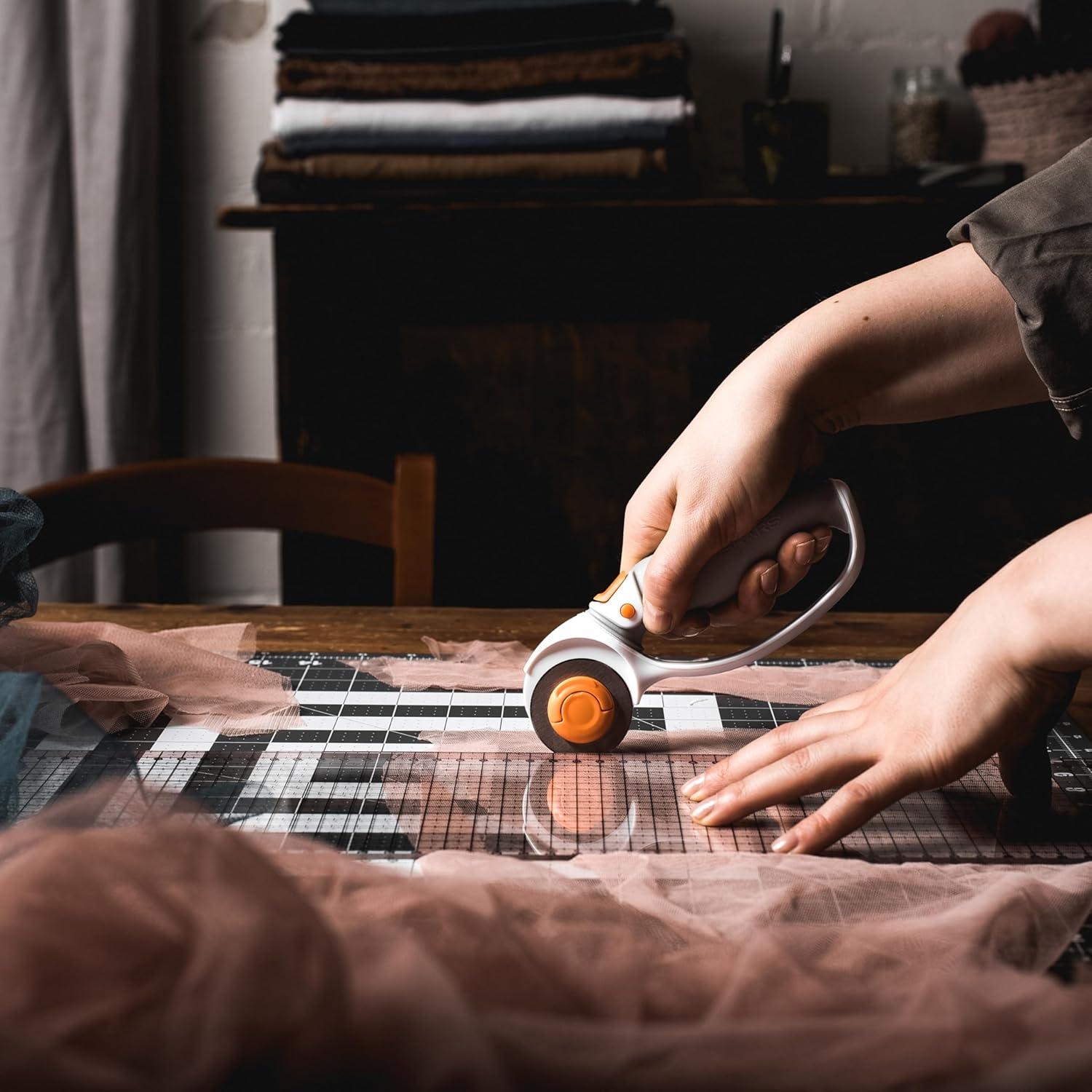 imageFiskars 45mm Rotary Cutter for Fabric Premium Steel Stick Fabric Cutter Cuts Through Multiple Layers Right and Left Handed Easy and Safe Blade Change Arts and Crafts Sewing and Quilting ToolsTitanium
