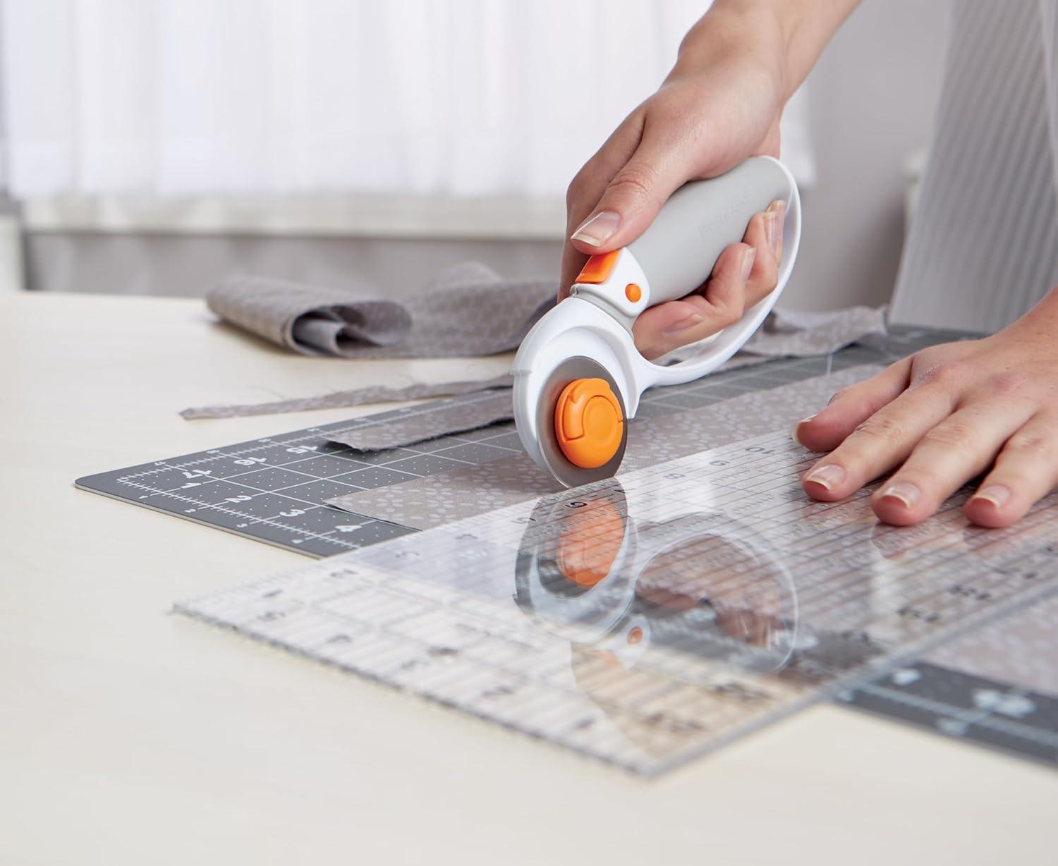 imageFiskars 45mm Rotary Cutter for Fabric Premium Steel Stick Fabric Cutter Cuts Through Multiple Layers Right and Left Handed Easy and Safe Blade Change Arts and Crafts Sewing and Quilting ToolsTitanium