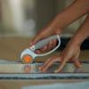 imageFiskars 45mm Rotary Cutter for Fabric Premium Steel Stick Fabric Cutter Cuts Through Multiple Layers Right and Left Handed Easy and Safe Blade Change Arts and Crafts Sewing and Quilting ToolsTitanium